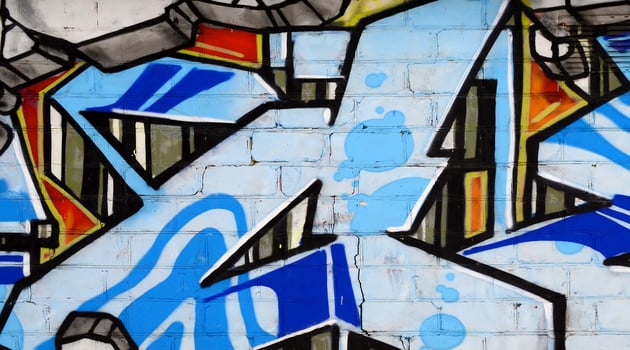 Colorful background of graffiti painting artwork with bright aerosol outlines on wall. Old school street art piece made with aerosol spray paint cans. Contemporary youth culture photo