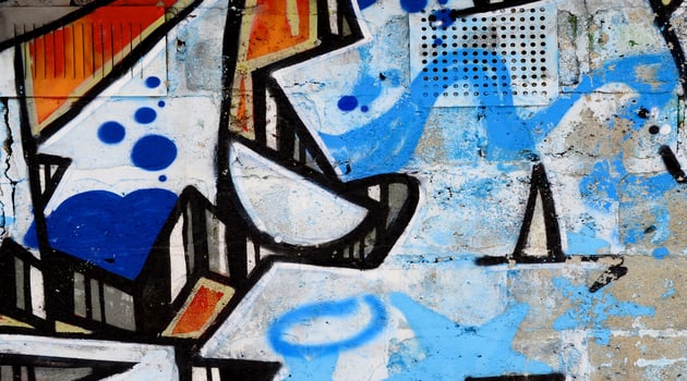 Colorful background of graffiti painting artwork with bright aerosol outlines on wall. Old school street art piece made with aerosol spray paint cans. Contemporary youth culture photo