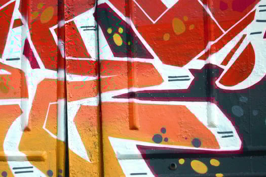 Colorful background of graffiti painting artwork with bright aerosol outlines on wall. Old school street art piece made with aerosol spray paint cans. Contemporary youth culture photo