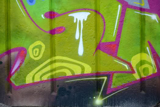 Colorful background of graffiti painting artwork with bright aerosol outlines on wall. Old school street art piece made with aerosol spray paint cans. Contemporary youth culture photo