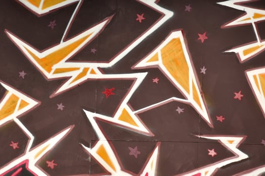 Colorful background of graffiti painting artwork with bright aerosol outlines on wall. Old school street art piece made with aerosol spray paint cans. Contemporary youth culture photo