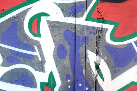 Colorful background of graffiti painting artwork with bright aerosol outlines on wall. Old school street art piece made with aerosol spray paint cans. Contemporary youth culture photo