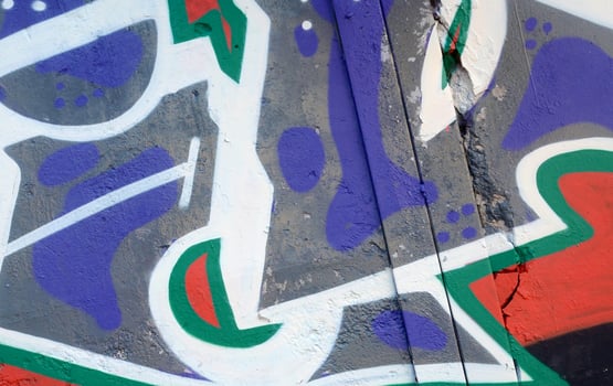 Colorful background of graffiti painting artwork with bright aerosol outlines on wall. Old school street art piece made with aerosol spray paint cans. Contemporary youth culture photo
