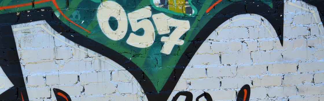 Colorful background of graffiti painting artwork with bright aerosol outlines on wall. Old school street art piece made with aerosol spray paint cans. Contemporary youth culture photo