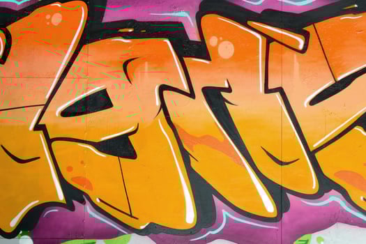 Colorful background of graffiti painting artwork with bright aerosol outlines on wall. Old school street art piece made with aerosol spray paint cans. Contemporary youth culture photo