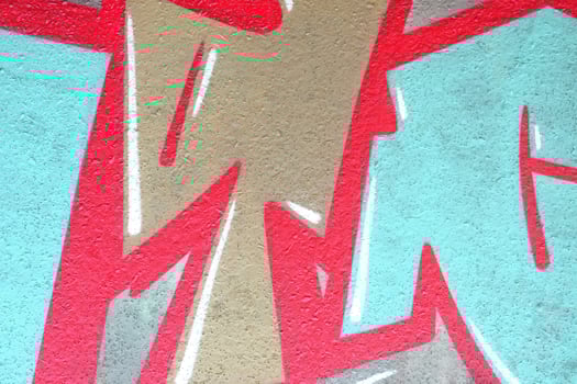 Colorful background of graffiti painting artwork with bright aerosol outlines on wall. Old school street art piece made with aerosol spray paint cans. Contemporary youth culture photo