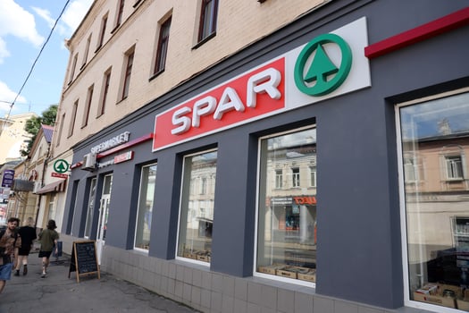 KHARKIV, UKRAINE - AUGUST 29, 2021 Spar logo on a wall. Spar is an international group of independently owned and operated retailers and wholesalers who work together photo