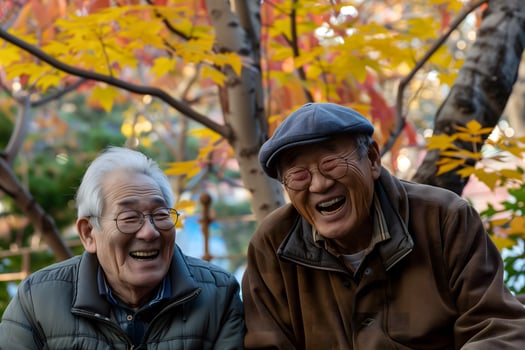 korean senior friends laughing together on an autumn day photo
