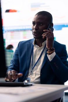 Chief financial officer sharing firm progress on a phone call with the main investor, ensuring performance based on current situation. Administrator works to expand enterprise budget. photo