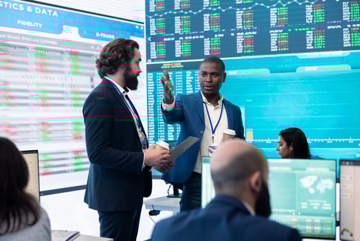 Pleased general director and investor showing statistics data to the team, proud of their organizational activity. Manager assembles with coworkers for a briefing meeting, studying sales reports. photo
