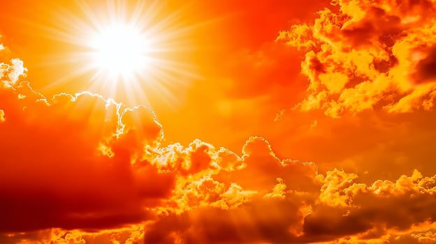 Heat stroke - Concept for climate change, heat wave or global warming, orange sky with clouds and bright sun photo