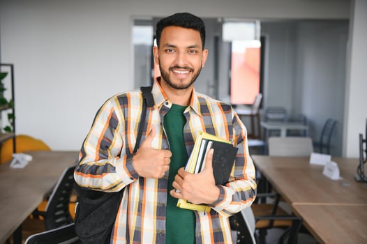 Happy indian male student at the university photo
