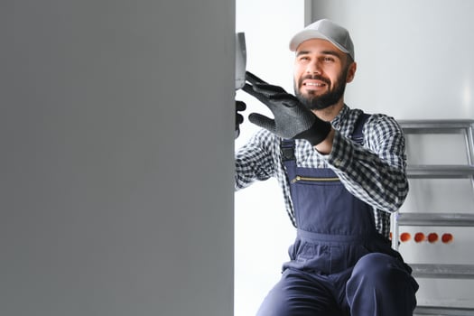 Positive male repairman at home photo