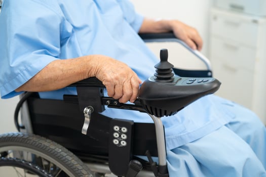 Asian senior woman patient on electric wheelchair with remote control at hospital, healthy strong medical. photo