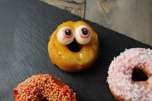 Halloween cake. Holiday treats with funny scary faces photo