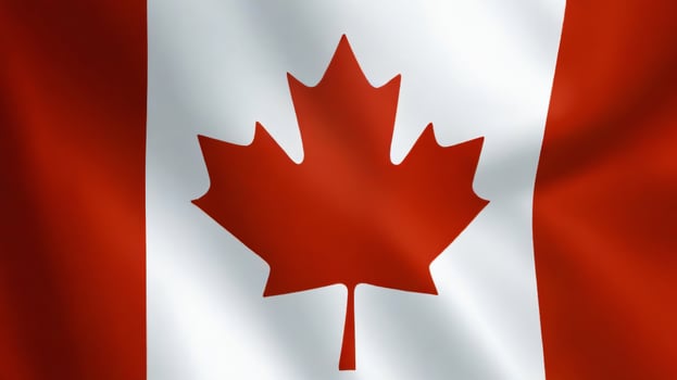 Beautiful Canadian flag flying in the outdoor. Canadian flag waving on the wind, unfiltered and natural lighting, good for multimedia online content photo