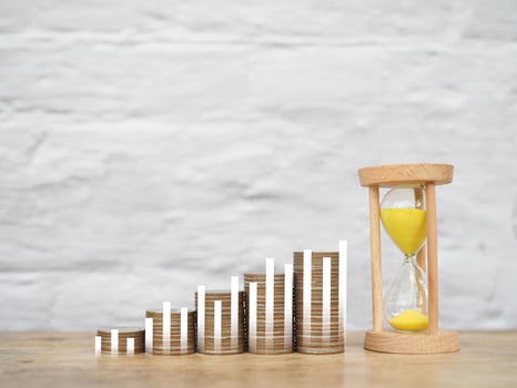 Hourglass, Stack of coins with virtaul increasing graph. The concept of business growth, Financial investment, Market stock, Profit return, Dividend and Business fund photo