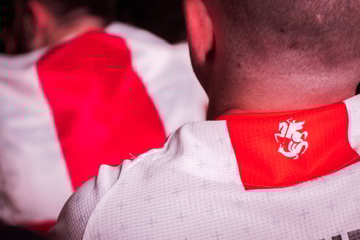 Tbilisi, Georgia - 20th june, 2024- Georgia country national football team supporters t-shirts with national markings. EURO 2024 football match supporters in tribunes. photo