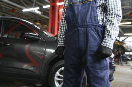 Indian happy auto mechanic in blue suit. photo