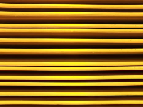 Abstract background image of vibrant color yellow metal sheets. Yellow metal tile fence background. Yellow zinc metal sheet texture. photo