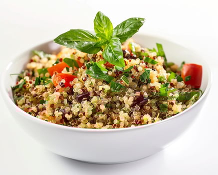 a bowl of quinoa salad with fresh herbs photo