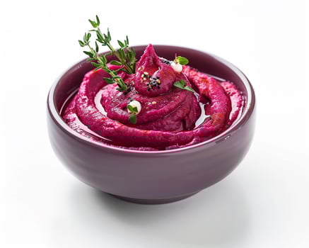 a bowl of beetroot dip with herbs photo