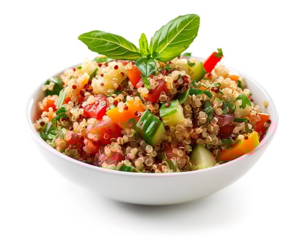 a bowl of quinoa salad with vegetables and herbs photo