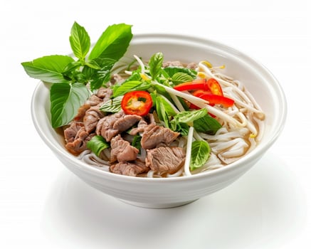 a bowl of pho with meat and vegetables photo