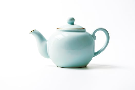 Blue Teapot on White Background photo