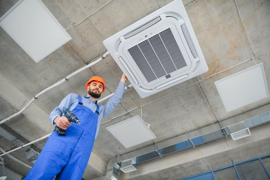 technician service checking and repairing air conditioner indoors photo