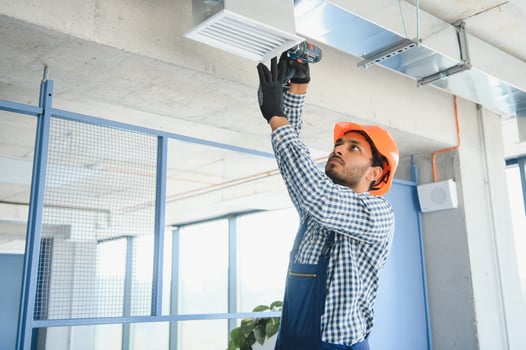 Ventilation cleaning. Specialist at work. Repair ventilation system HVAC. Industrial background photo