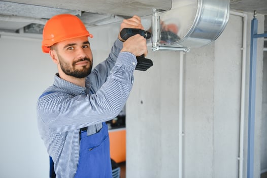 ventilation system installation and repair service. hvac technician at work. banner copy space. photo