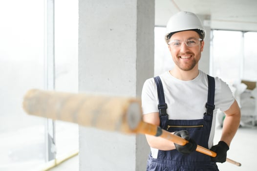 A happy worker proudly standing at his workplace. photo