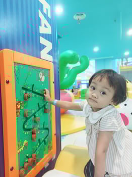 Positive activities for children playing in an indoor area filled with toy facilities and a place where they can find unlimited creativity photo