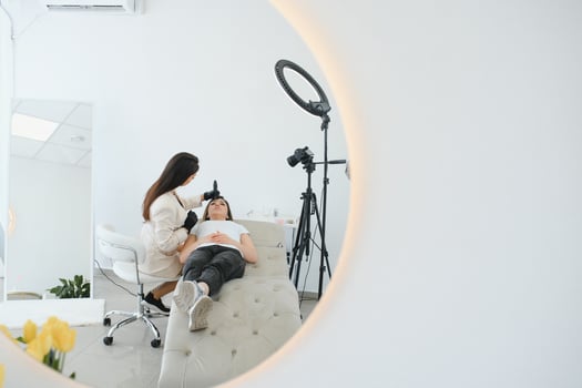 Permanent make up procedure. Lip makeup in tattoo salon. photo