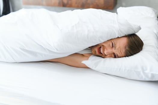 Young man in bed , trying to sleep photo
