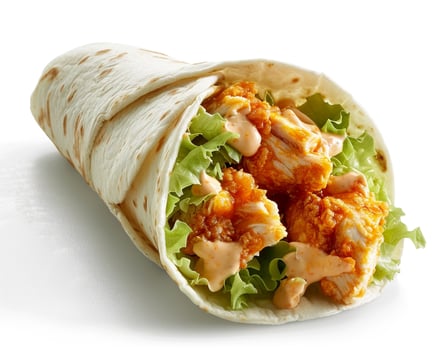a chicken wrap with lettuce and cheese on it photo