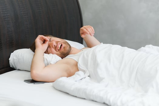 Young man in bed , trying to sleep photo