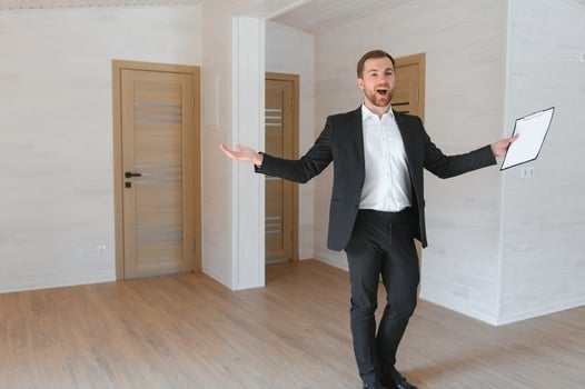 Estate Agent Looking Around Vacant Property For Valuation photo