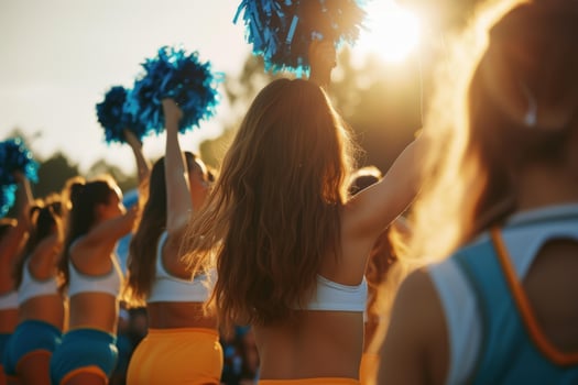 Cheerleading squad in sunset performance photo