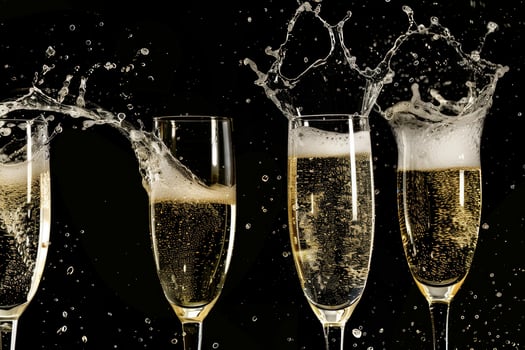 Champagne celebration toast with splashing bubbles photo