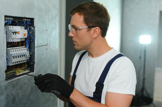 Portrait of an electrician at work photo