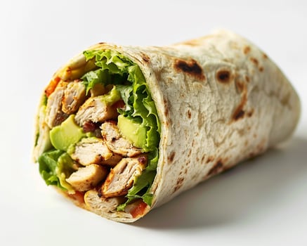 a chicken wrap with lettuce and tomatoes on a white background photo
