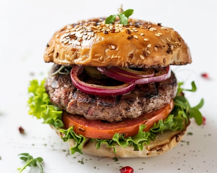a hamburger with vegetables and meat on a white background photo