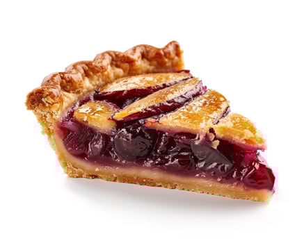 a piece of pie with cherries on it photo