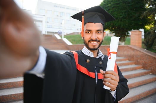 indian male graduate taking selfie photo