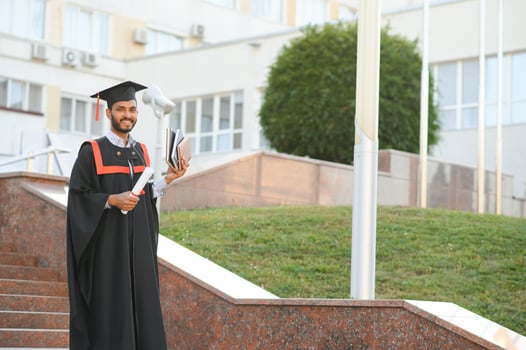 education, graduation and people concept - happy Indian Male graduate student. photo