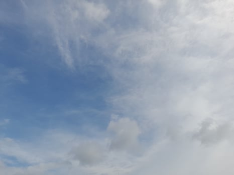 Beautiful white clouds on deep blue sky background. Large bright soft fluffy clouds are cover the entire blue sky. photo