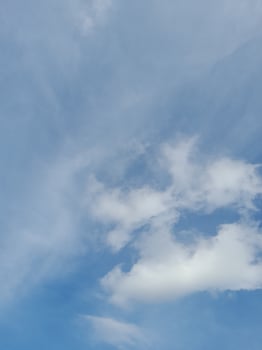 Beautiful white clouds on deep blue sky background. Large bright soft fluffy clouds are cover the entire blue sky. photo