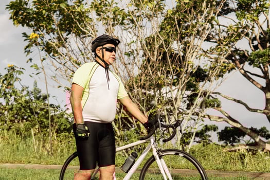 mature cyclist man with his bike photo